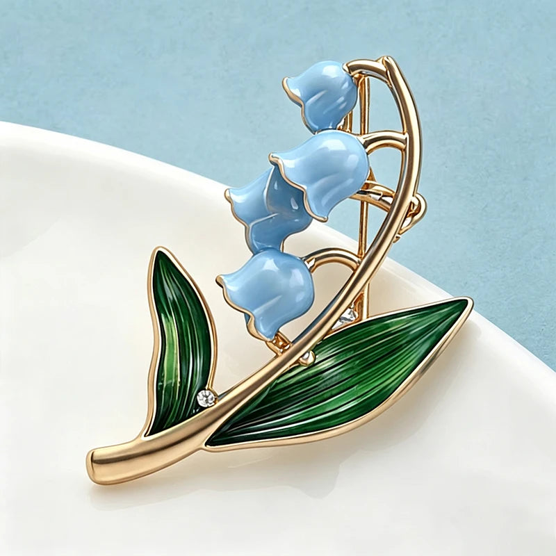 Wuli&baby May Birthday Flower Lily Brooches Pins For Women Lady Enamel Plants Flowers Office Casual Brooch Pin Fashion Gifts